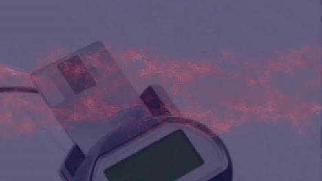 animación de humo rojo sobre el terminal de pago