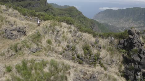 drone shot of the landscape at caminho do pinaculo e foldhadal in madeira with the valley below