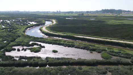 Curving-tributary-of-Aveiro-Ria-in-Veiros,-Estarreja,-Portugal---aerial