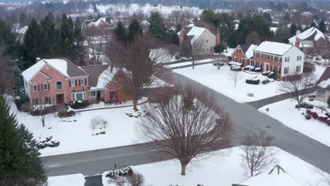 aerial of large colonial houses in upscale home development community