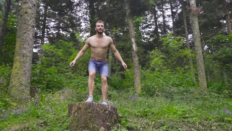 athletic man doing jump in sport exercise in slow motion.