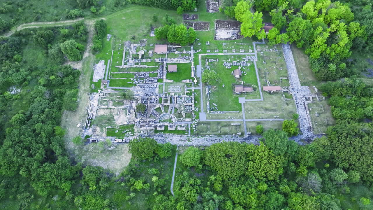 Aerial pullback shot of Nicopolis ad Istrum, ancient Roman city ruins near Veliko Tarnovo, Bulgaria