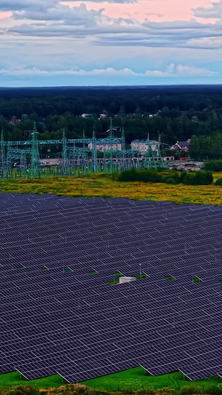 Solar panels in a field, vibrant sunset, eco-friendly energy source