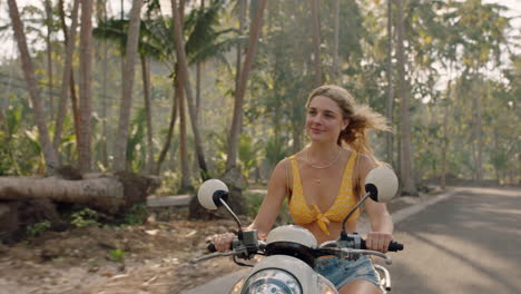 travel woman riding motorcycle on tropical island road trip enjoying motorbike ride happy independent woman exploring freedom on vacation