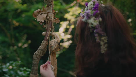 young druid girl contemplates her staff close up shot