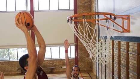 basketball players playing in the court