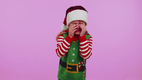 Upset-disappointed-girl-Christmas-Santa-Claus-Elf-wipes-tears,-cries-from-despair-not-received-gift