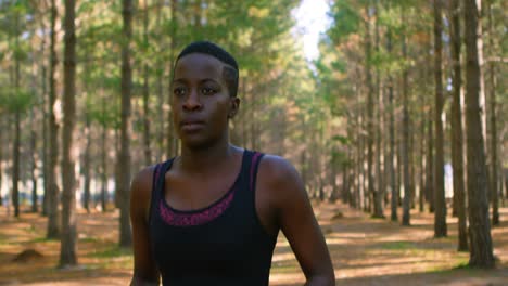 woman jogging in the forest 4k