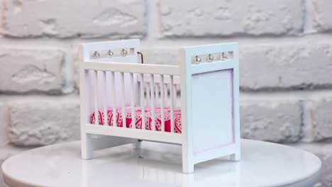 small white bed toy for doll. miniature white bedroom sleepping interior.