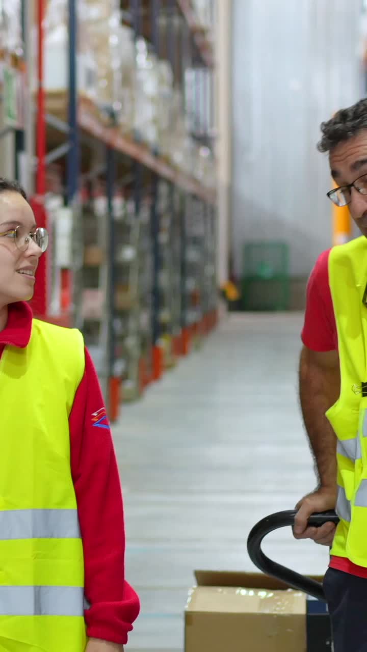 Warehouse workers moving inventory