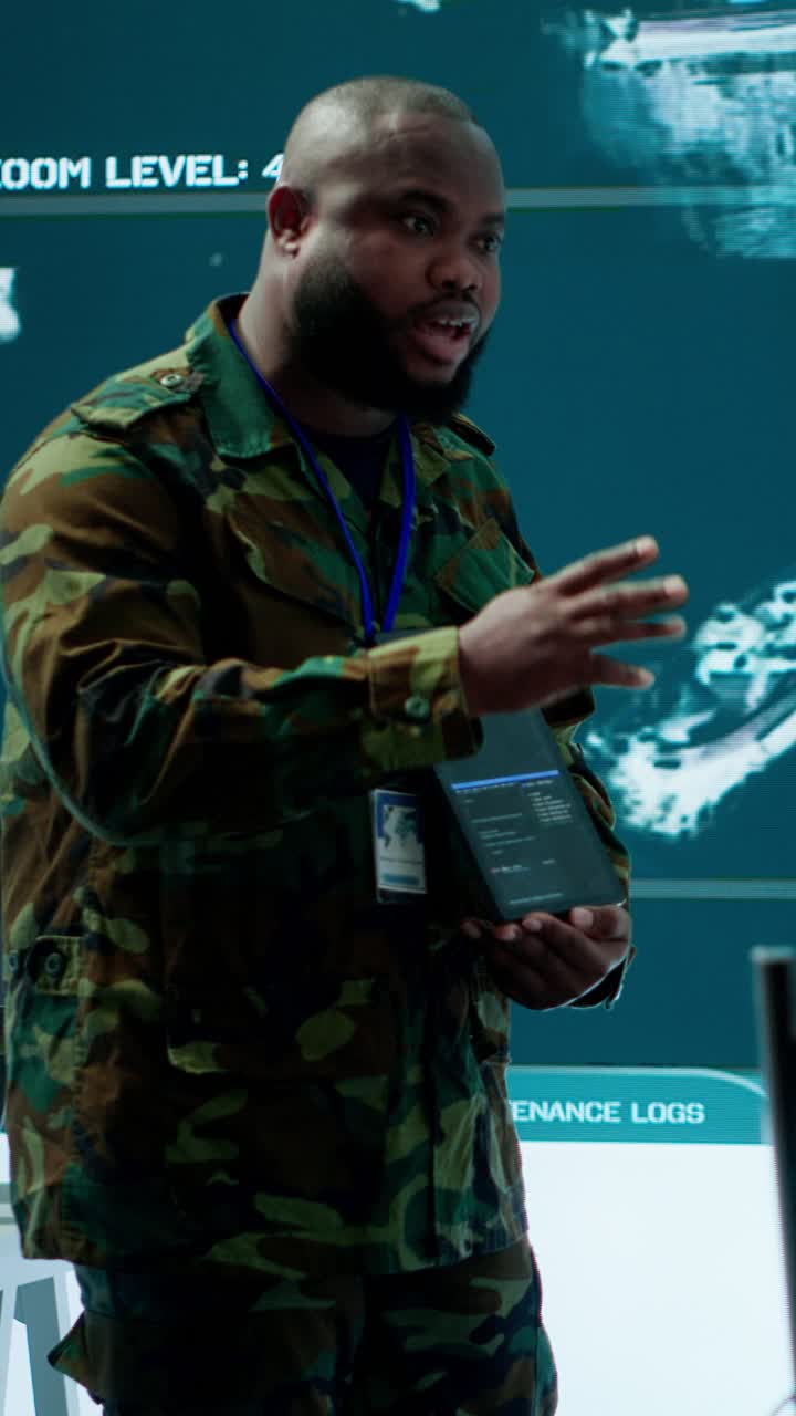 Vertical Video Military officer leads cybersecurity efforts in a high tech control center