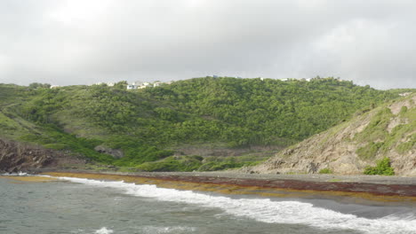 abandoned caribbean beach, dawn. smooth fly in, low to the beach below covered in seaweed. a small town can be seen on mountains in the distance. birds fly around. part 2 of 2.
4k uhd at 23.98 fps.