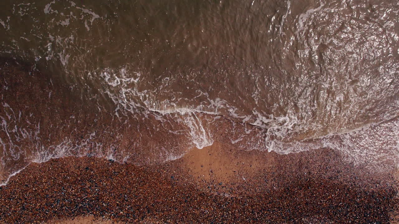 Intense Aerial View of Ocean Waves on the Beach. Calm Wave Crashing from Above.