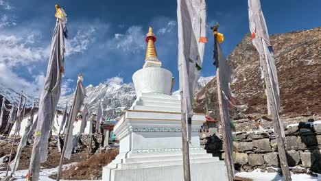 buddhist enlightenment stupa in surrounded by white prayer flag