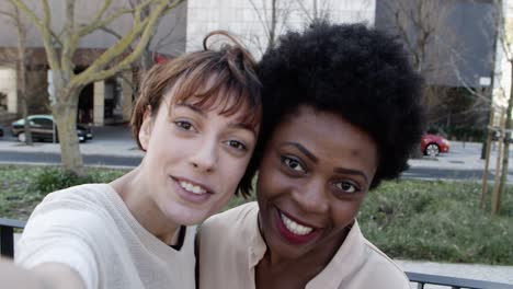 two cheerful women posing for self portrait