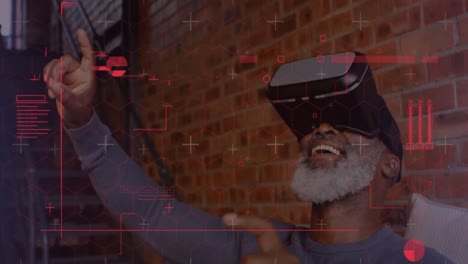 Digital-interface-with-data-processing-against-african-american-senior-man-wearing-vr-headset