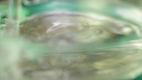 blurred close-up of liquid in glass container