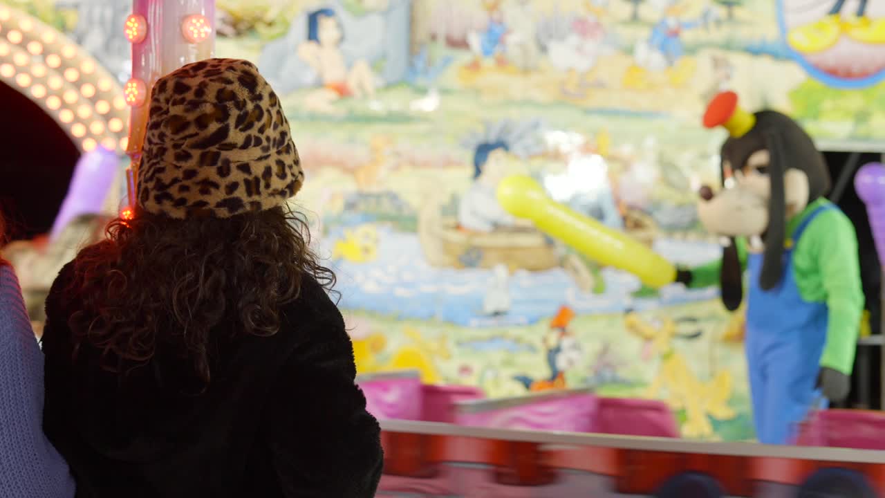 Child watching a dog costume character at a winter fair