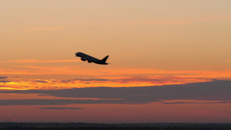 airplane taking off against the evening sky