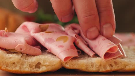 making a sandwich with ham
