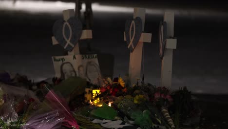 Michigan-State-University-Mass-shooting-memorial-at-the-Rock-with-markers-and-candles