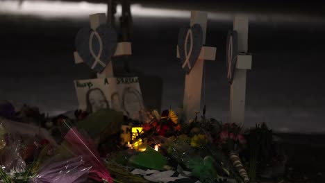 michigan state university mass shooting memorial at the rock with markers and candles