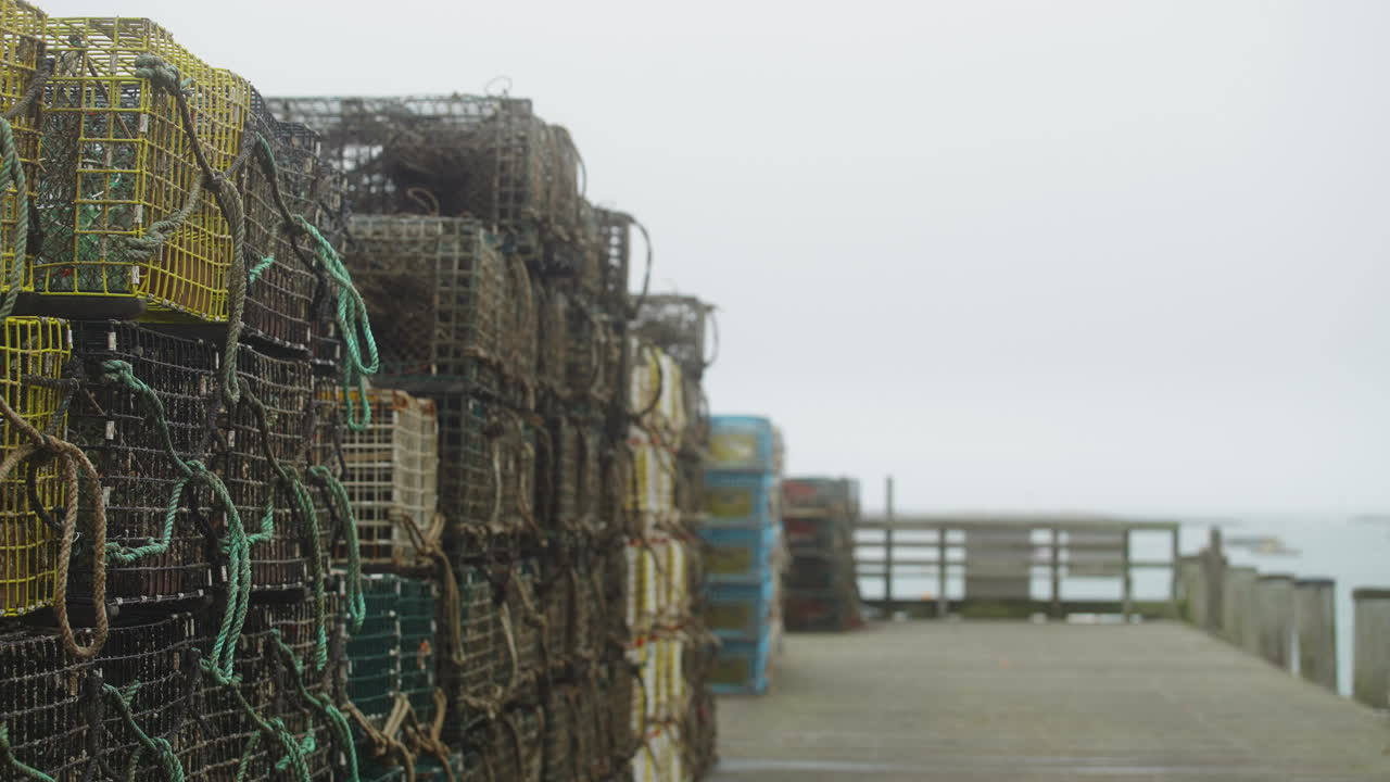 Lobster traps on pier in Maine new England with moody foggy weather 4k 60p