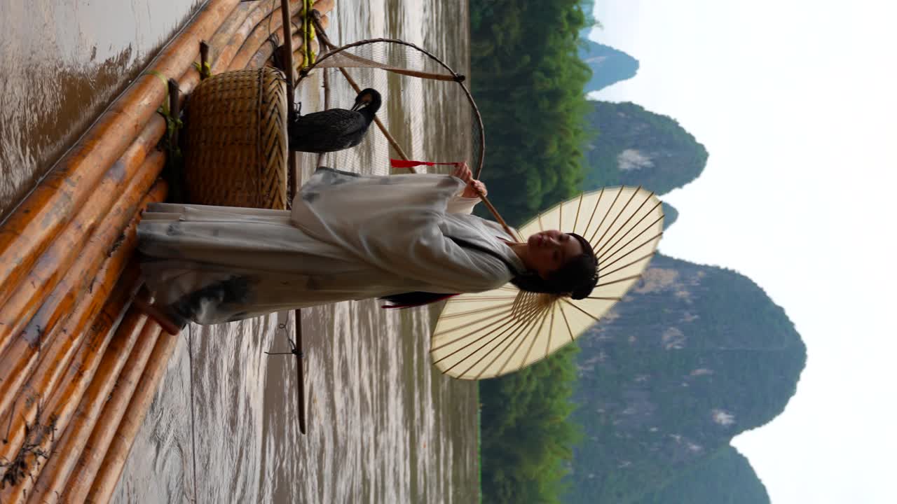 Hanfu girl photo session on bamboo raft, Xingping, China