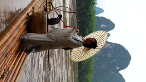 hanfu girl photo session on bamboo raft, xingping, china