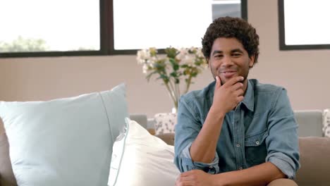 Handsome-smiling-man-posing-on-his-couch