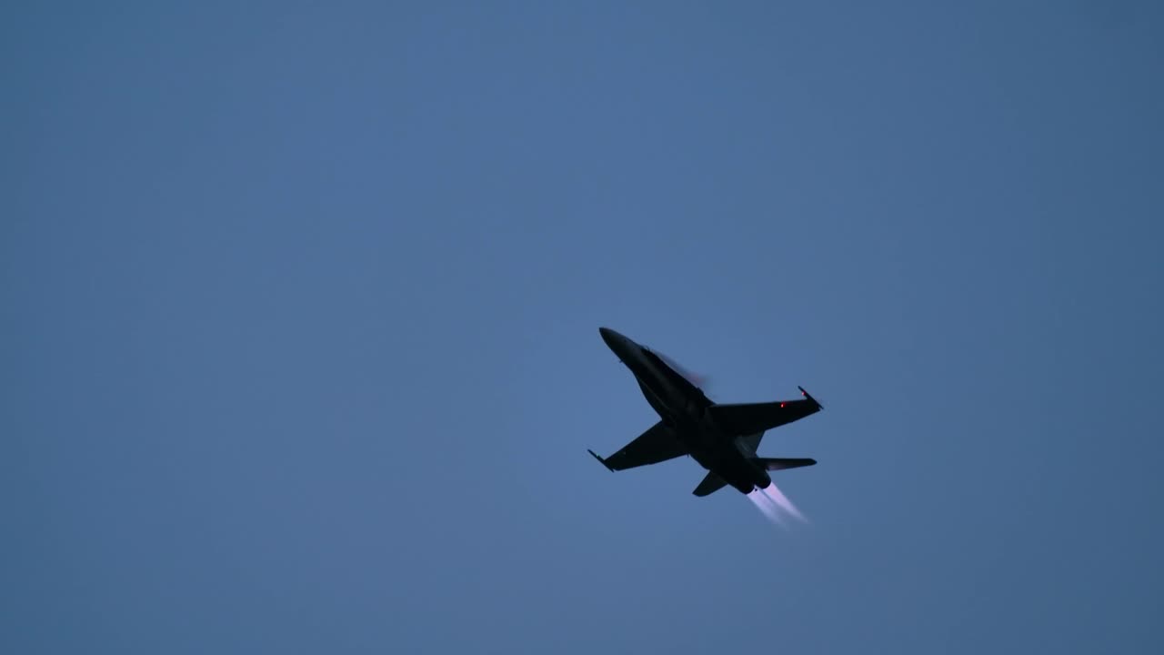 Fighter Jet in Flight at Dusk