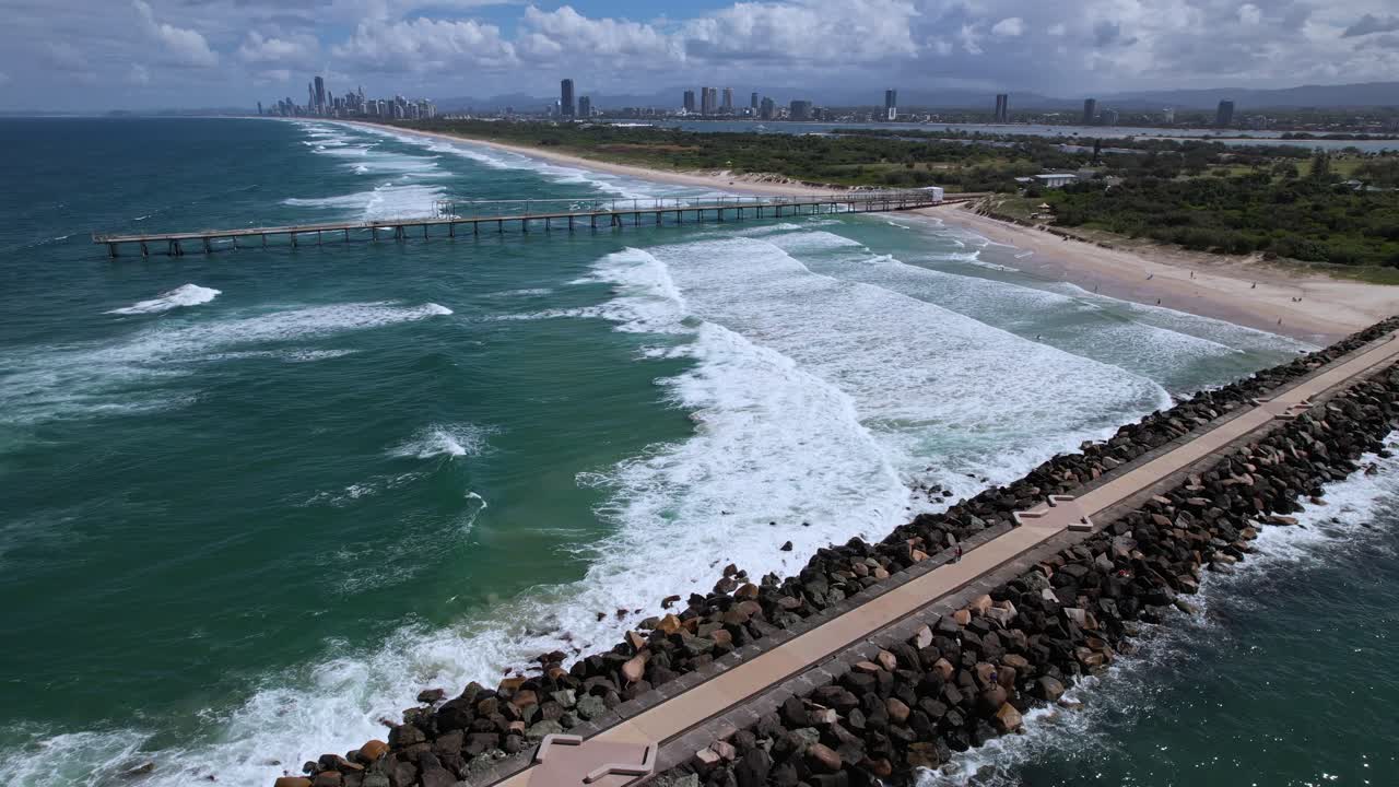 Foamy Waves Splashing At The Spit Dog Beach In Main Beach, Queensland, Australia - Drone Shot