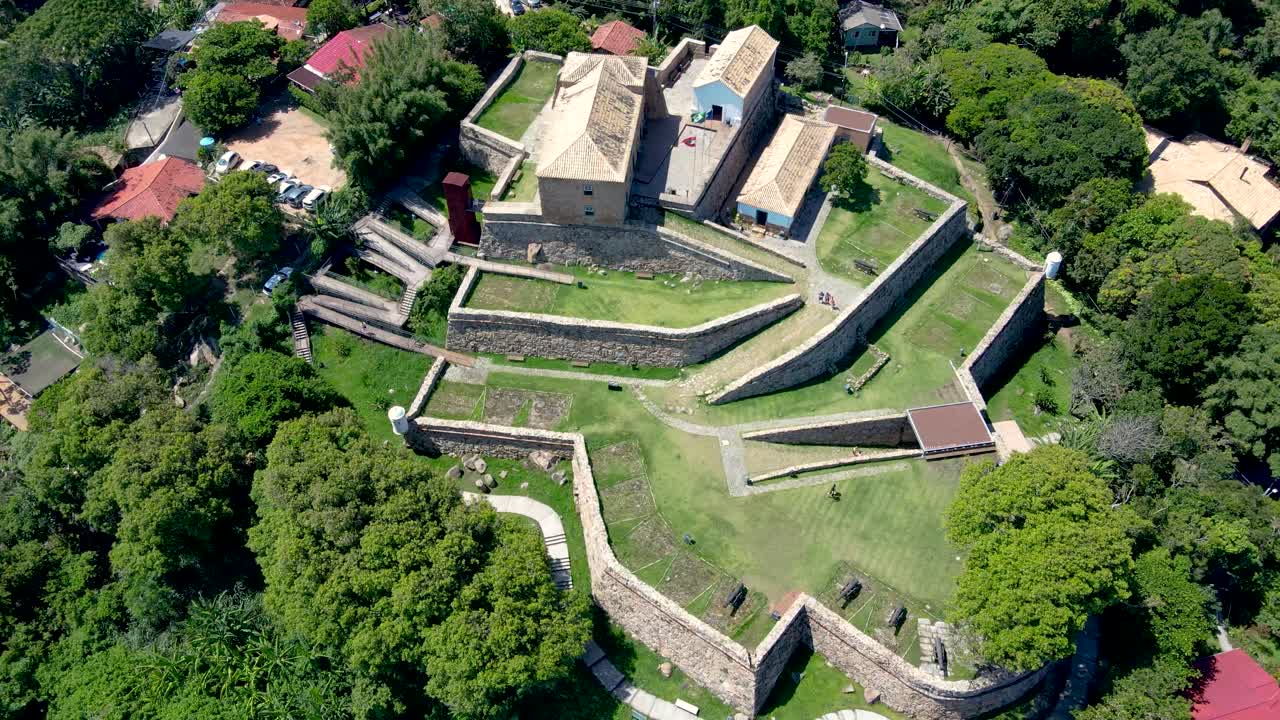 Aerial drone top view of São José da Ponta Grossa Fortress of colonial architecture era Brazil empire in Praia do Forte and Jurere Internacional, Florianópolis, Santa Catarina