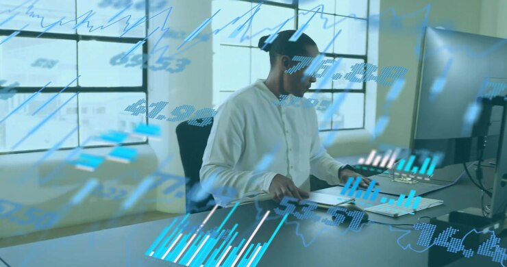 Mature adult man adjusting screen inputting data and checking notebook as market data scrolling