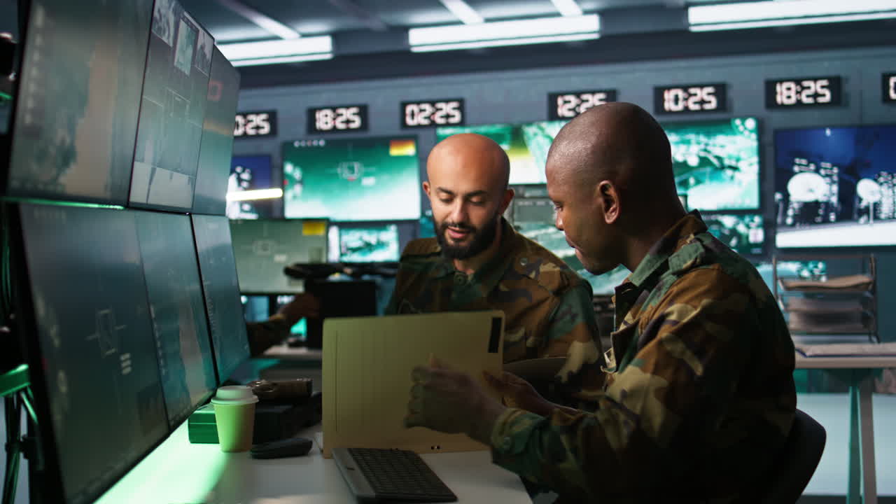 Teamworking military agents look at intel folder files