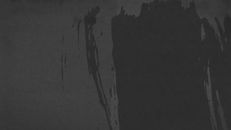 animation of black marks and scratches moving on dark grey background