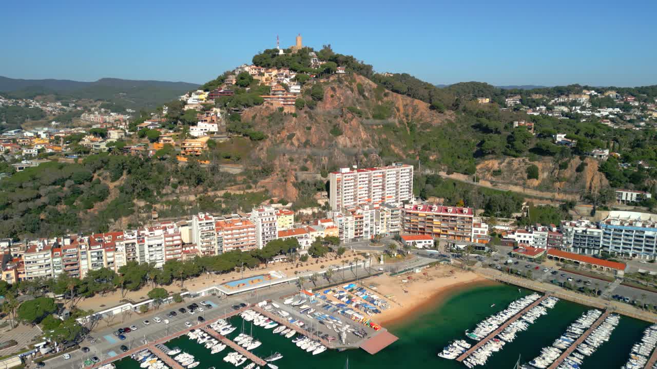 Blanes blanes cityscape, aerial view of the harbor, beach and san juan castle, costa brava, catalonia, spain