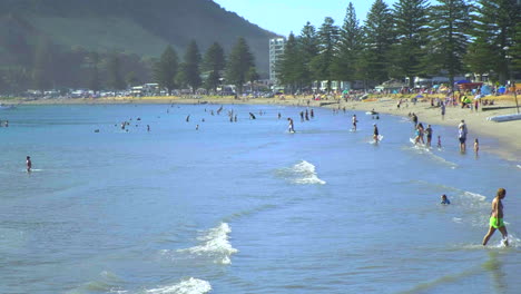 People-at-Pilot-Bay,-Mount-Maunganui