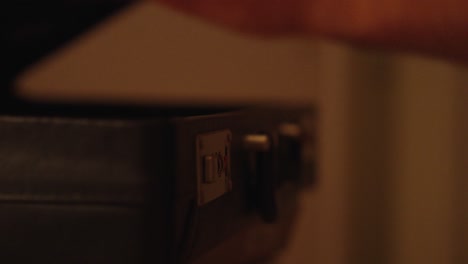 classic briefcase: black briefcase lock opens close up