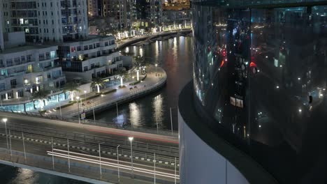 the stunning view of the dubai marina during the night - time lapse