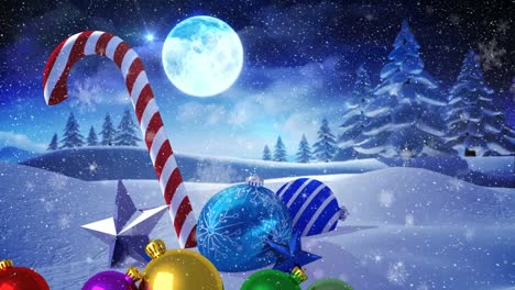 Animation-of-snow-falling-over-christmas-decorations-and-winter-landscape