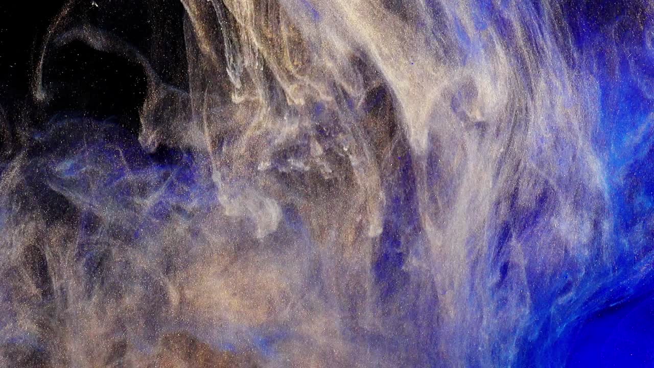 Forme astratte. Riprese su sfondo nero. Mescolanza di colori