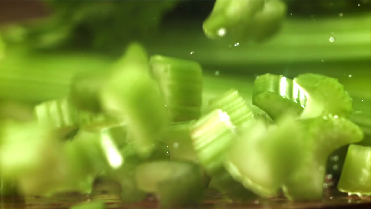 Fresh Chopped Celery Pieces Falling in Slow Motion