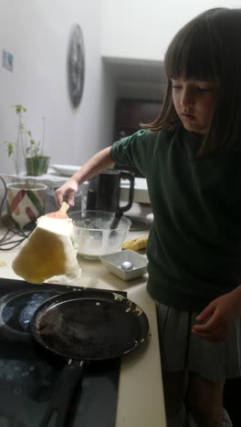 child making pancakes