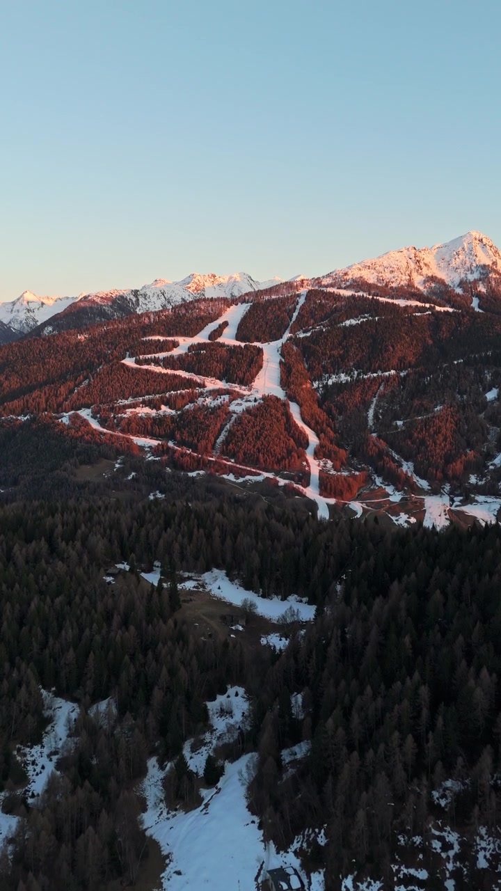 Sunset over Swiss Alps, snowy slopes, serene and majestic view