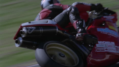 motorcyclists race around a track