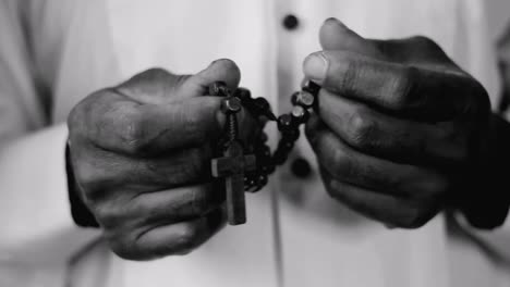 man praying to god with cross hands together with cross stock footage