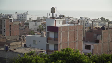 A-view-of-new-urban-development-in-close-proximity-to-the-ocean-in-Huanchaco,-Trujillo,-La-Libertad,-Peru