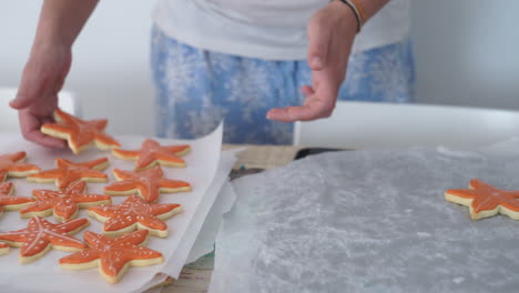 footage of a caucasian woman making starfish cookies