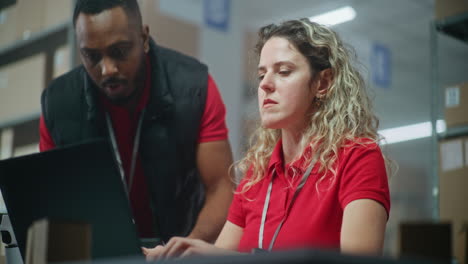 warehouse team working on laptop